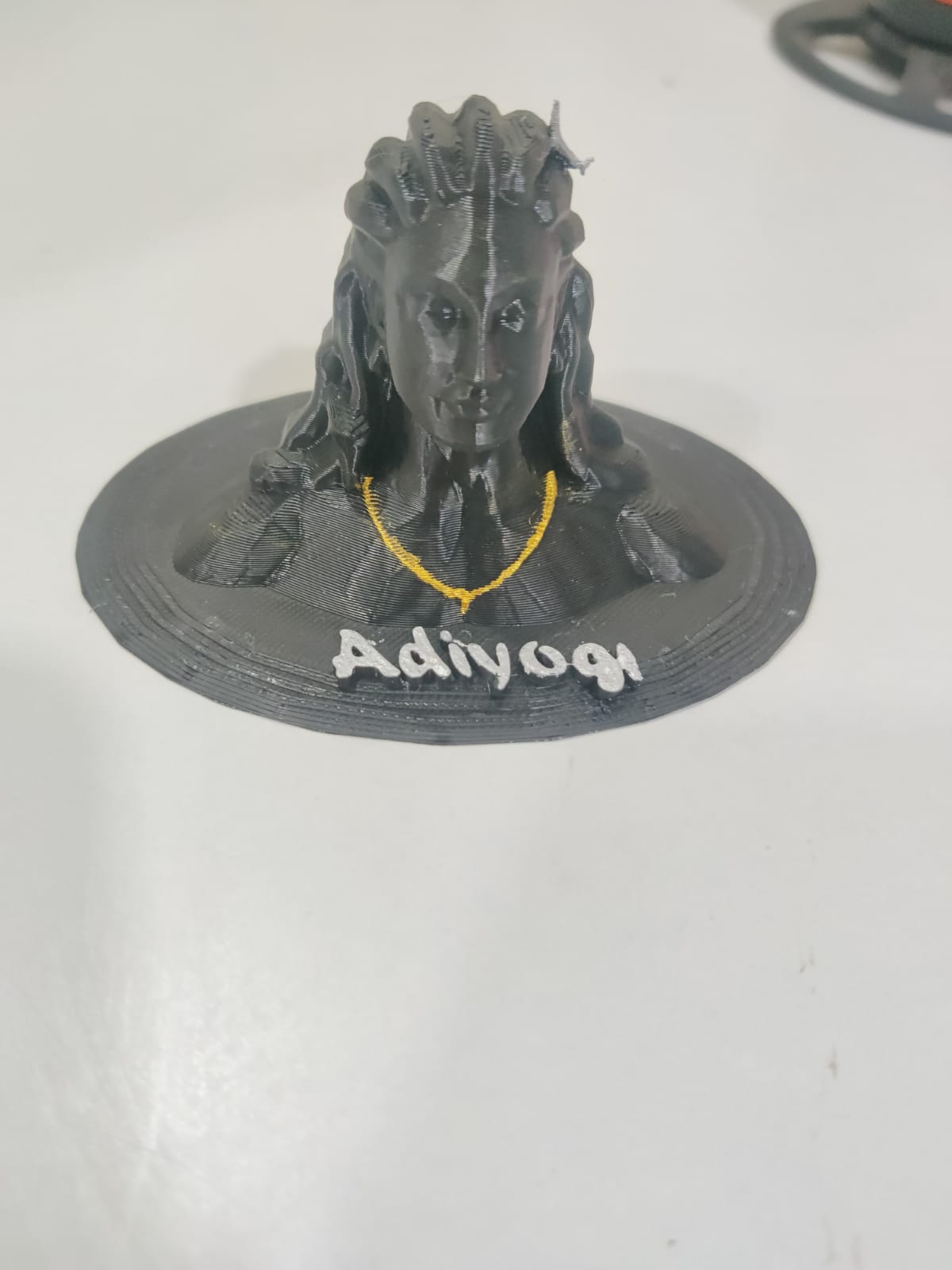 3D-printed figure with 'Adiyogi' text on a white background