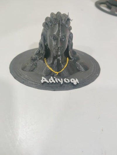 3D-printed figure with 'Adiyogi' text on a white background